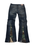 R3VIVED custom Levi bootcut jeans in blue denim featuring unique camo pattern flare inserts at the leg hems