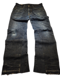 R3VIVED custom Levi's 511 bootcut jeans in dark blue denim with a frayed hem and subtle whiskering detail.